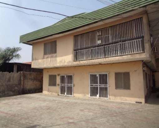 FOR SALE @ SATELLITE TOWN :  A Storey building consists of :  5br flat + 3br flat + 2br flat + 2no of 1br apartments, Security house on  640sqm